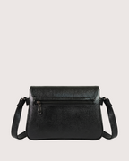 Black leather handbag on a light gray background