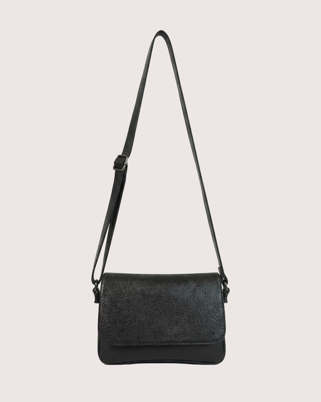 Black crossbody bag on a light gray background