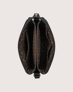 Brown leather bag with visible pattern on a light gray background