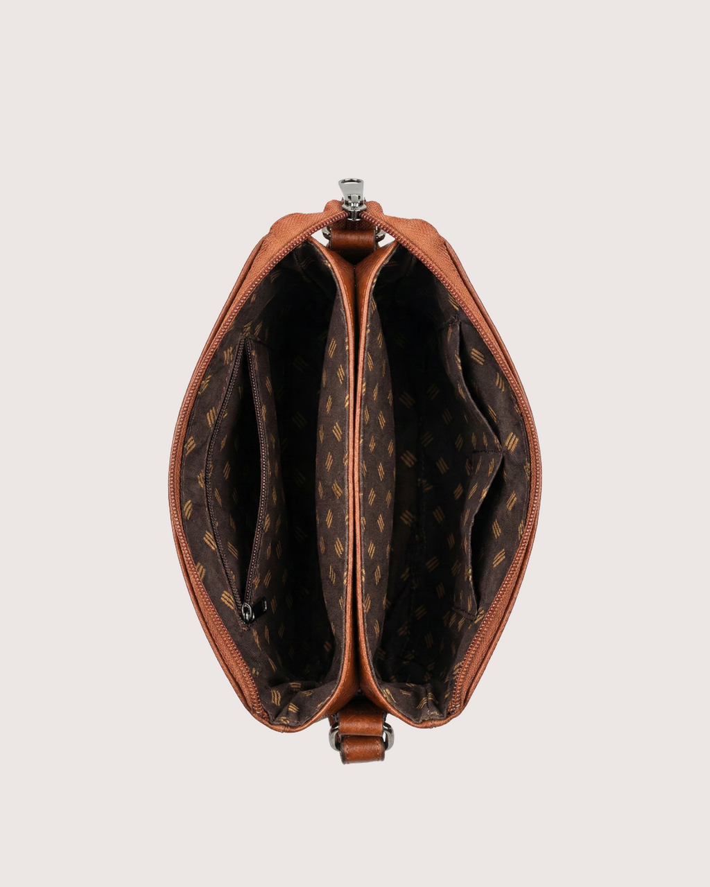 Tan leather handbag with patterned interior on a light gray background
