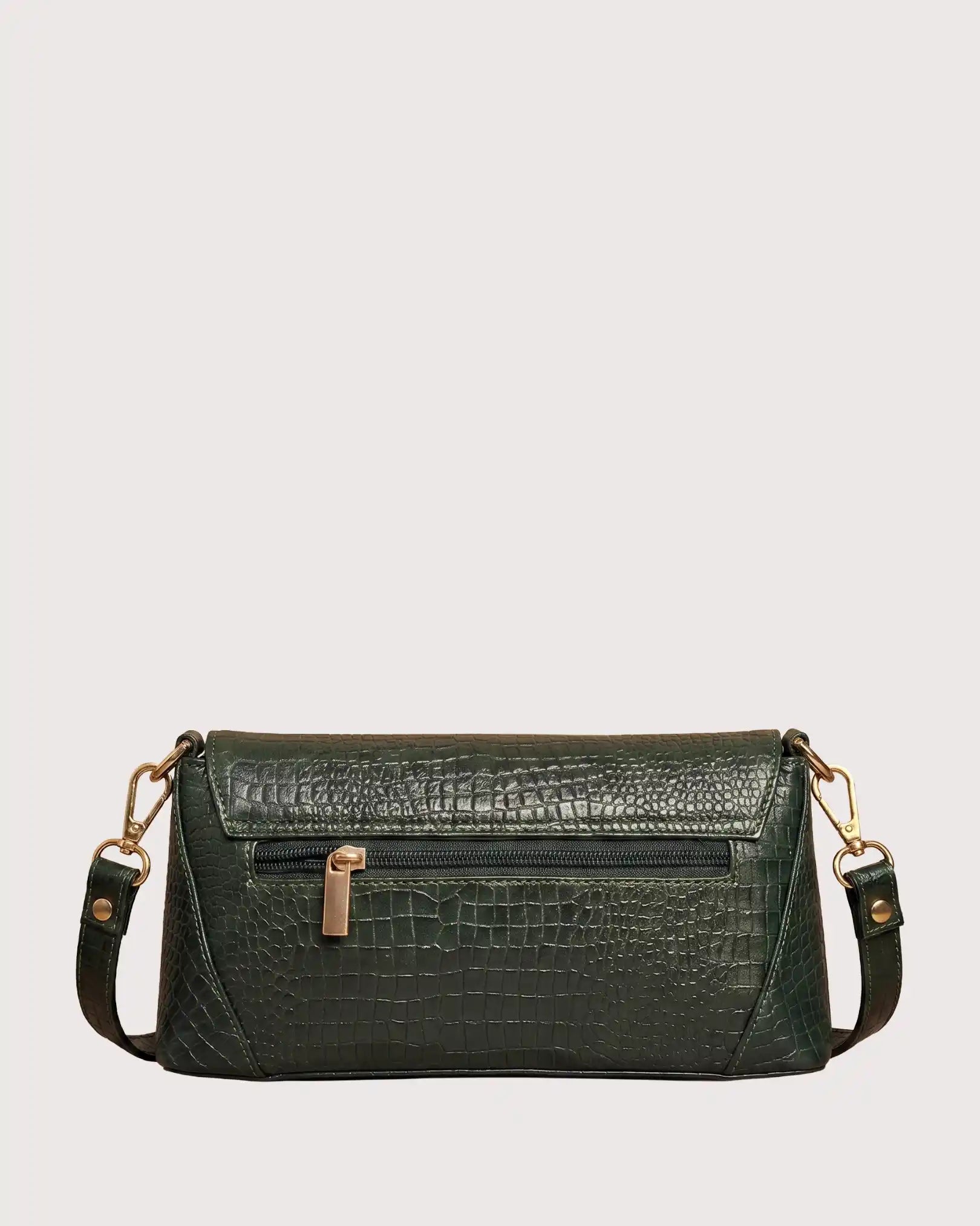 Back view of green croc-embossed handbag with zippered pocket and adjustable shoulder strap