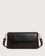 Black croc-embossed shoulder bag with flap closure, structured silhouette, and gold-tone hardware