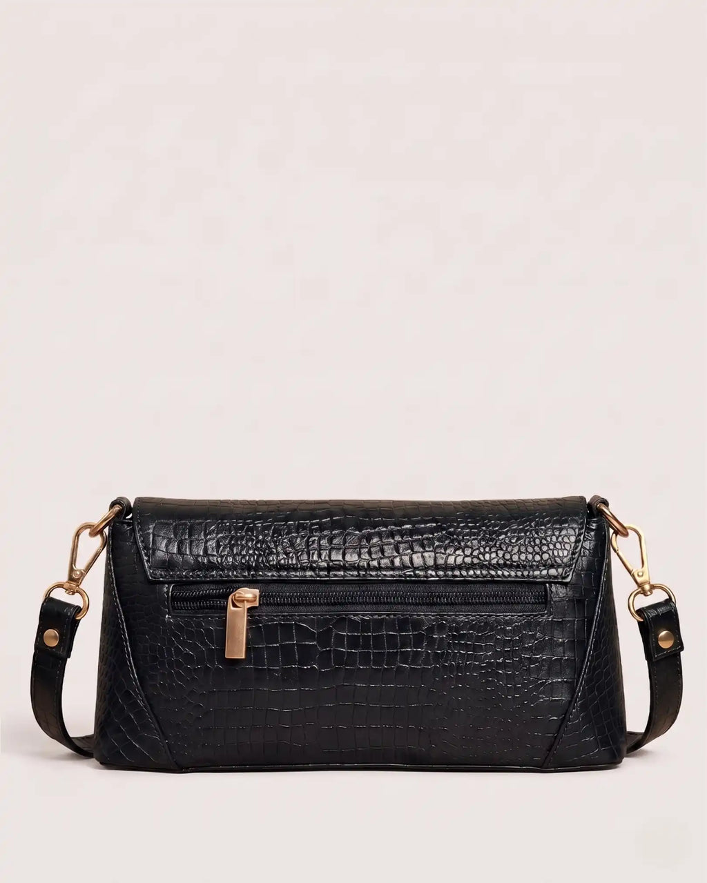Back view of black croc-embossed handbag with zippered pocket and adjustable shoulder strap
